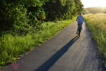 young woman cycling on the road