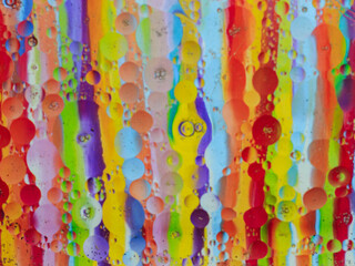 Oil bubbles in water glass, background