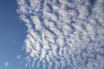 Deep blue sky and white cloud background.Altocumulus clouds.