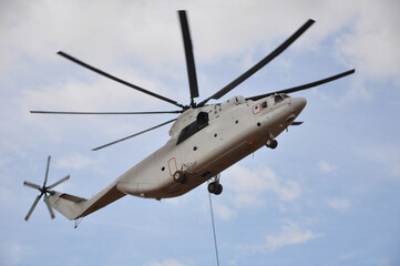 transport helicopter with cargo on the construction of an oil field in Siberia Yakutia