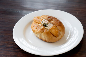 closed up sausage roll , sausage bread (hot dog) sausage bun , soft baked bun stuffed with pork sausage for fast food breakfast or coffee break selective focus.                           
