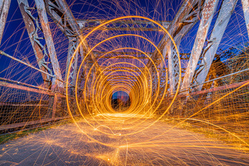 Low light photography using a Wire Wool Spinning technique. Old railway bridge over the River Avon, Stratford upon Avon