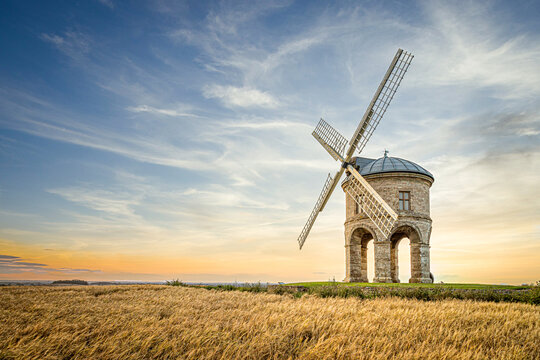 Chesterton windmill in the countryside with a summer sunset