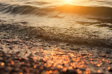 Fototapete Zen Steine Sea surf on sunset time. Black Sea coast. Pebble washed by sea waves.  © Valentina