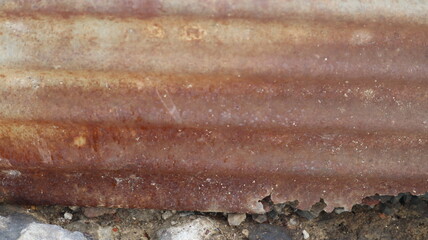 Rusting on zinc sheets exposed to sunlight and rain for a long time