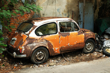 The old decay car left at wall