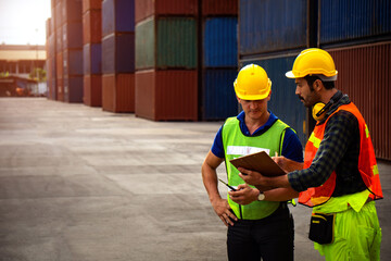 Two industrial workers are discussing the job plan