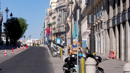 Madrid, Spain.june 02, 2020.CARDBOARD BOXES STACKED FOR RECYCLING, NEXT TO A BICYCLE SHARING IN ALCALA STREET, MADRID