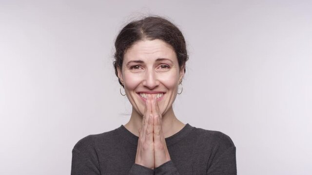 Portrait of a beautiful middle aged woman of Spanish descent smiles wide and is thankful