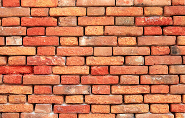 Old red brick wall background in Venice, Italy.