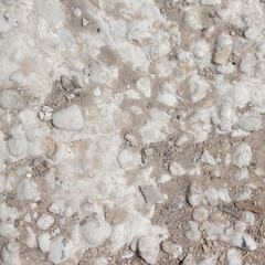background texture of sand concrete and stones. construction hair dryer