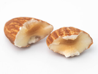 Close-up of almond nuts slice isolated on white background.