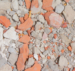 background texture of sand concrete and stones. construction background, fragments of bricks and stones on the sand