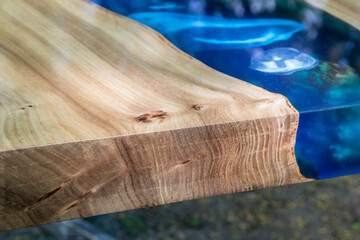 Beautiful wooden table made of elm slab with epoxy resin filling