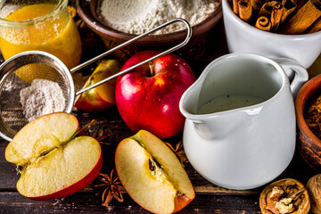 Autumn baking concept. Cooking baking background with ingredients, spices and utensils. All you need for baking traditional autumn apple pie, on rustic wooden background copy space