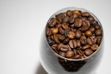 cup of coffee beans on a white background