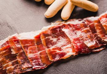 Spanish cured ham or Iberian Jamón close up.