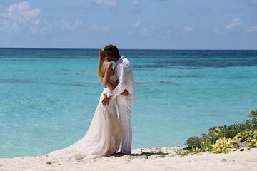 Fototapeta na wymiar bride and groom on beach
