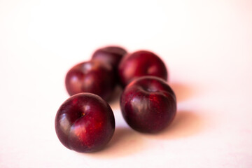 plums in light background