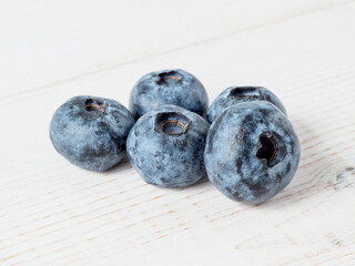 Fresh blueberries on wooden background.