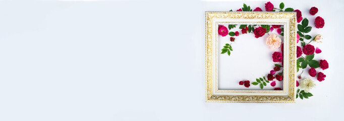 Flowers composition. Rose flowers and frame on white background. Flat lay, top view