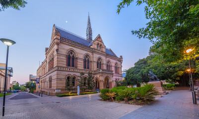 Sunset view of statue of Sir Walter Hughes in front of the University of Adelaide in Australia