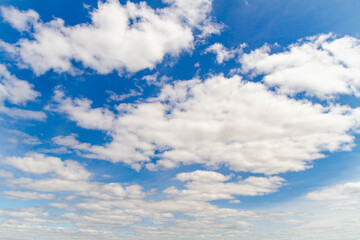 Obraz na płótnie Canvas Bright blue sky with white clouds.