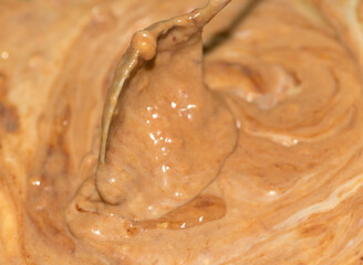 transfer milk chocolate cream with spoons