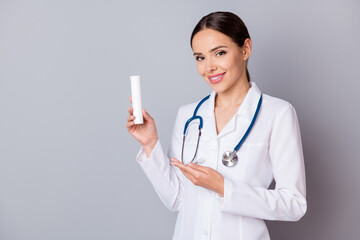 Photo of cheerful family doc lady professional advising patients vitamins complex bottle good...