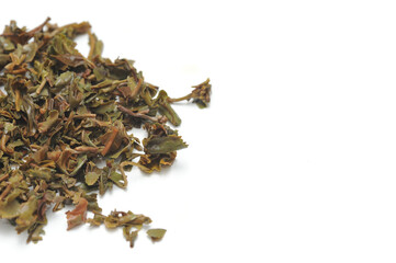 Loose black tea leaves used after brewing tea with it, isolated, white background