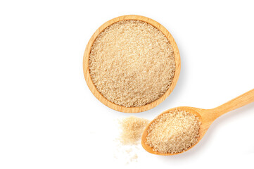 Brown sugar in wooden bowand spoon on white background. top view

