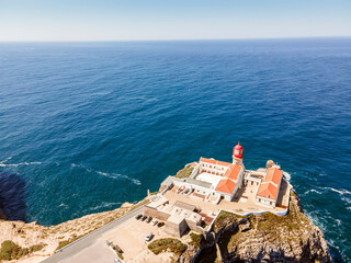 Beautiful lighthouse located on high cliffs of Saint Vincent cape in Algarve, Portugal