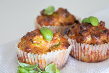 Fresh baked savory muffin. With herb spread and sprinkled with basil. healthy muffin. fresh baked food
