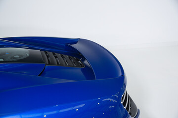 Rear spoiler on blue sports car