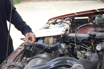 Fototapeta premium auto mechanic changing car engine