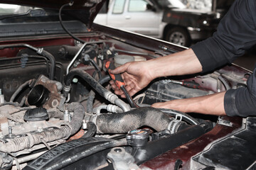 Fototapeta na wymiar auto mechanic changing car engine