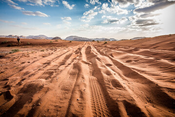 Fototapeta na wymiar Four Wheel Drive car tire print on sand dune at wadi rum, jordan
