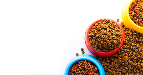 plastic bowl full with dry dog food isolated on white background. Top view grain pet food with copy space of text design. Above or Top view. food texture banner..