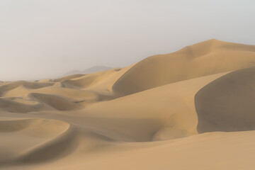 Fototapeta na wymiar Beautiful and hot desert in Ica, Peru. Sand dunes. 