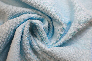 use a twisted blue towel with folds as a background