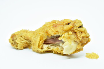 crispy fried chicken drum wing biting on white background