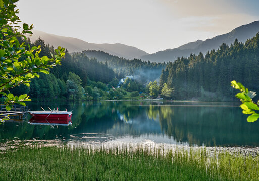 Beautiful landscape photo of Karagol / Karag&ouml;l Lake, surrounded by trees with boars on dock, Savsat / Şavşat, Artvin, Black Sea region of Turkey 