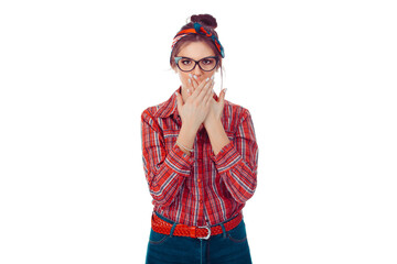 Surprised young woman covering mouth with hands.