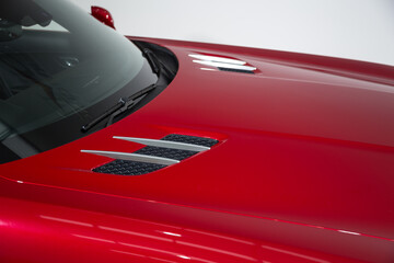 Isolated bonnet of a red sports car