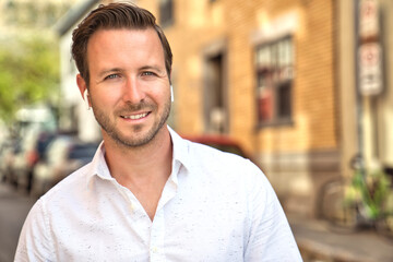 Fototapeta premium Portrait of an handsome man on the urban background