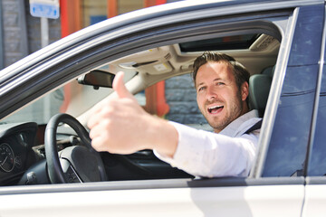 A Portrait of man on his car look nice