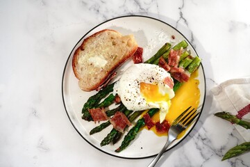 Poached egg with grilled asparagus, selective focus