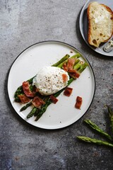 Poached egg with grilled asparagus, selective focus