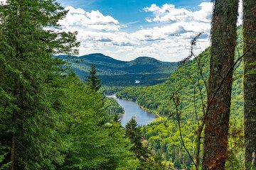 Awesome summer view from a verdant hill in Jacques Cartier National Park, Quebec province, Canada