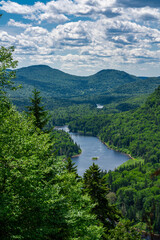 Fototapeta na wymiar Awesome summer view from a verdant hill in Jacques Cartier National Park, Quebec province, Canada